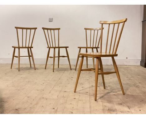 A Set of four light beech and plywood Ercol style comb back dining chairs, H81cm, W38cm, D36cm