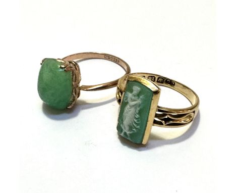 A 9ct gold green jadeite cabuchon ring, mounted in claw setting, signs of glue to mount, size Q, and an 18ct gold green carve