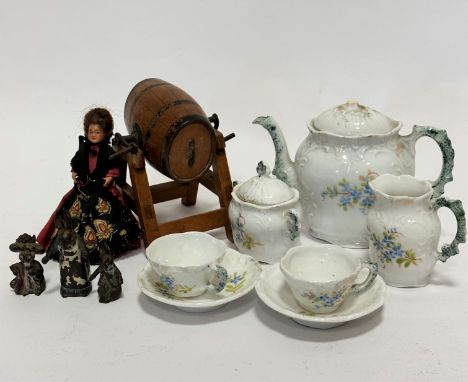 An Edwardian china seven piece doll style teaset complete with teapot (missing knop), milk jug, sugar basin, two teacups and 