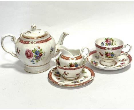 A Tuscan china Lowestoft morning tea set for one including teacup, saucer, milk jug, sugar basin, side plate and teapot, all 