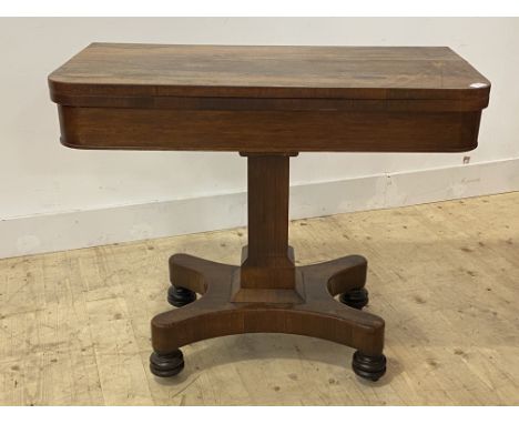 A mid 19th century rosewood card table, the fold over revolving top enclosing a baize lined playing surface, over an octagona