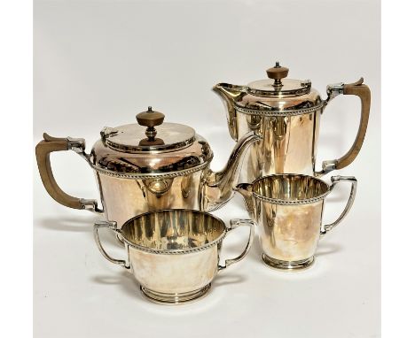 A 1930's Epns four-piece tea and coffee service with gadroon border, treen finial's and handles, complete with twin handled s