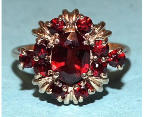 A 9ct gold ring set garnet cluster, size R, 4.3g. 