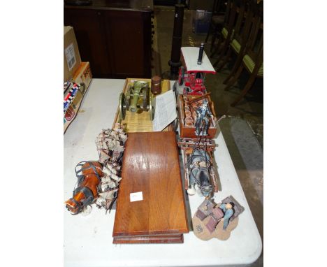 A brass and wooden model of a cannon and carriage, a Leonardo Collection model of a tractor engine and other items. 