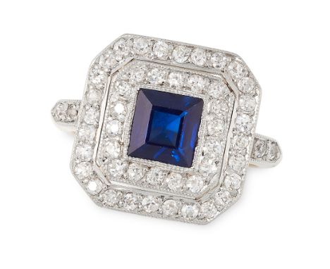 A SAPPHIRE AND DIAMOND DRESS RING, CIRCA 1930 in 18ct yellow gold, set with a square cut sapphire of 1.18 carats within a dou