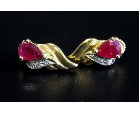 PAIR OF RUBY AND DIAMOND EARRINGSin attractive wavy nine carat gold setting 