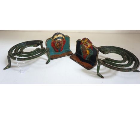 PAIR OF CAST IRON NOVELTY BOOKENDSmodelled as native Americans, brightly decorated and wearing headdresses, 9.5cm high, toget