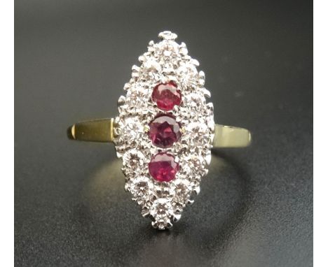 ART DECO STYLE DIAMOND AND RUBY CLUSTER RINGthe three central vertically set rubies in navette shaped diamond surround, on ei