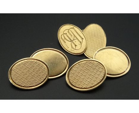 PAIR OF NINE CARAT GOLD CUFFLINKSwith engine turned decoration; together with a single nine carat gold cufflink with engine t