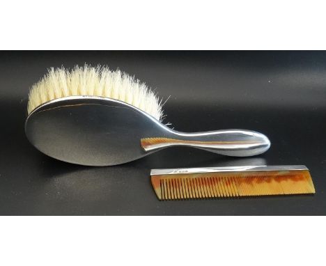 EDWARD VII SILVER BACKED HAIR BRUSHand comb, both stamped Robinson & Co Ltd, Singapore and hallmarked Birmingham 1902, cased 