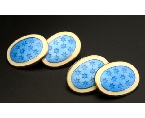 PAIR OF ENAMEL DECORATED SILVER GILT CUFF LINKSthe blue enamel with star detail within white border 