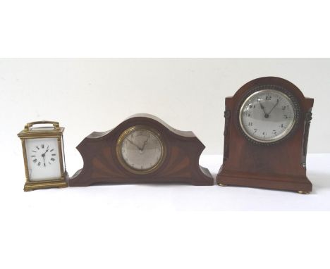MAHOGANY CASED MANTLE CLOCKwith an arched case with bead decoration around the circular silvered dial with Arabic numerals, 2