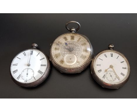 THREE SILVER POCKET WATCHEScomprising an Edwardian example with silvered dial and gilt Roman numerals, the case with engraved