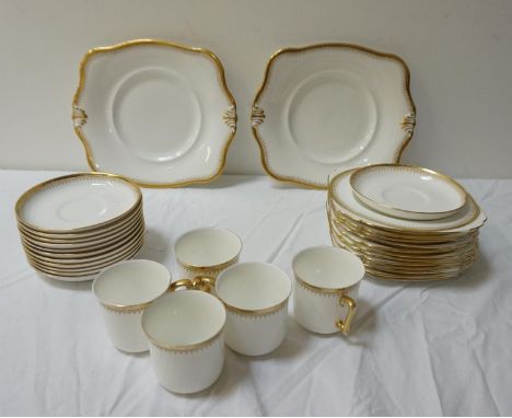 TUSCAN PORCELAIN TEA SERVICEthe white ground with gilt highlights, comprising tea cups and saucers, side and sandwich plates 