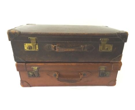 TWO VINTAGE LEATHER SUITCASESeach with re-enforced corners, brass locks and carry handles (2) 