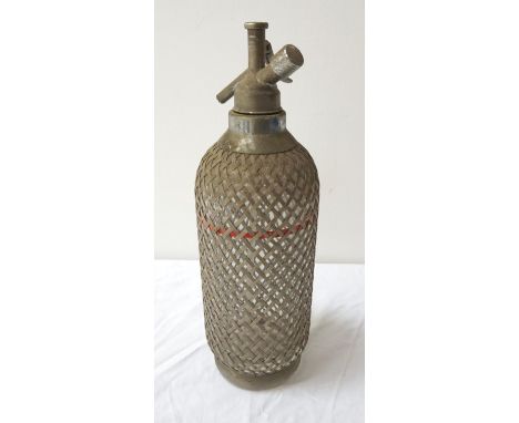 VINTAGE GLASS SODA SYPHONoverlaid with a metal wirework lattice, 34.5cm high 