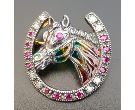 DIAMOND AND RUBY SET HORSE BROOCHthe horse with colourful filled panels and ruby eyes, within diamond and ruby set horseshoe,