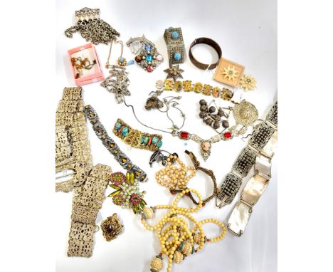 A group of various white metal jewellery pieces, including bracelets, mother-of-pearl, white metal and silver bracelets, neck