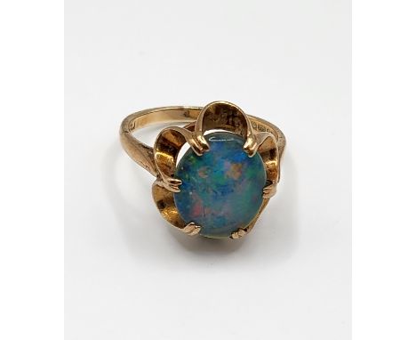 A 9ct yellow gold and triplet opal ring, set with an oval triplet within six claw setting, size O.&nbsp;3.6g