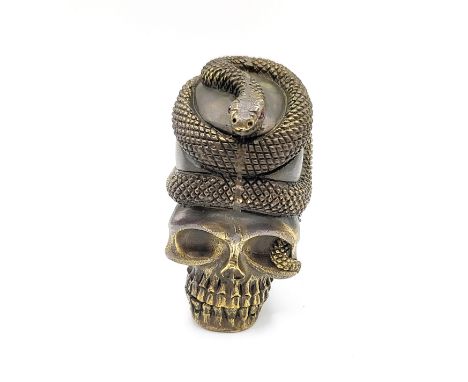 A novelty brass skull vesta case, with a coiled snake. 5.2cm 