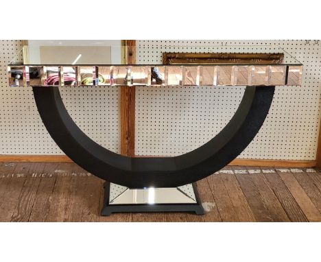 A mirrored console table with U-shaped base. 83cm x 137cm x 41cm. 