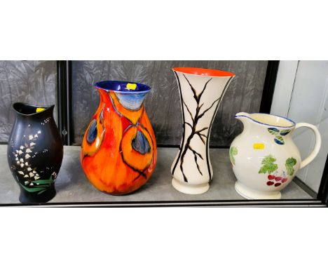 A Poole pear-shaped orange swirl vase with blue interior, 26cm, a Brentleigh Ware pottery trumpet-shaped vase, 29.5cm (small 