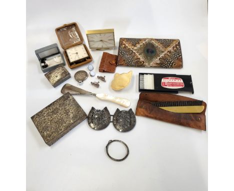 An eclectic mix including two mid-century travel alarms (an Oris and a Swiza), a feathered purse, clothes brushes, a mounted 