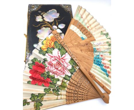 A lacquer covered notebook decorated with mother-of-pearl, together with two fans.
