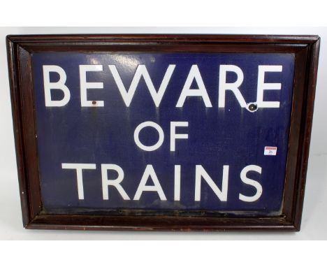 BR enamel sign 'BEWARE OF TRAINS' white on blue ground, now in wooden frame but shows original holes for screw fixing, two sm