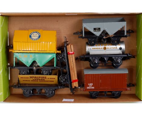 A small tray containing 7 postwar Hornby wagons including Blue Circle Cement, McAlpine side tipper, LMS goods van, BR hopper,