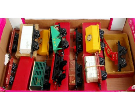 A large tray containing 12 postwar Hornby wagons including No. 1 crane truck (VG-BVG), cement wagon (NM-BVG), No. 1 lumber (V