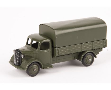 A scarce Dinky Toys American Export Issue Austin Covered Wagon (25WM/30SM). In Military olive green livery complete with tin 