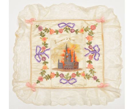 A WWI silk cushion cover “Souvenir d’Ypres”, coloured printed centre picture of Ypres in embroidered and applied silk wreath 
