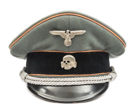 A Third Reich SS officer’s peaked cap,  with faded orange piping for Feldgendarmerie and silver bullion cords, the lining wit