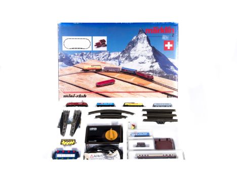 A Marklin ‘Mini Club’ Swiss issue Z gauge train set.  Comprising an SBB-CFF-FFS Bo-Bo electric locomotive 10101 in red livery