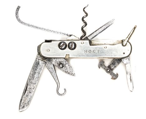 A coachman’s clasp knife,  with blades, bootlace hooks, pair studs for repairing straps, corkscrew, can opener, stone scoop, 