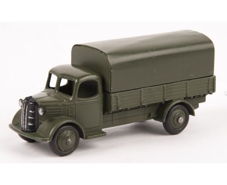 A scarce Dinky Toys American Export Issue Austin Covered Wagon (25WM/30SM). In Military olive green livery complete with tin 