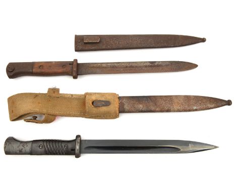 A WWII German K98 bayonet,  with bakelite grips, in its scabbard with a webbing frog, the bayonet GC, the scabbard and frog Q