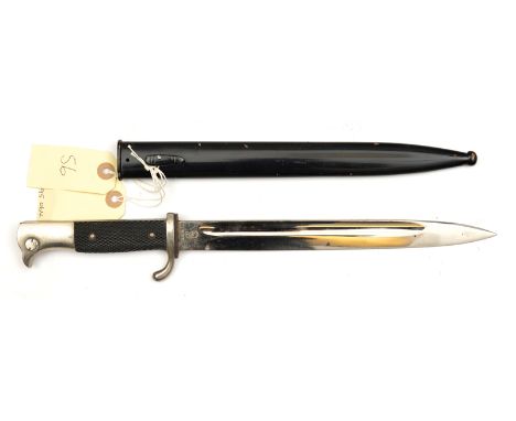 A Third Reich parade bayonet, plated blade 9¾”, by WKC, the plated hilt with bird’s head pommel and chequered black grips, in