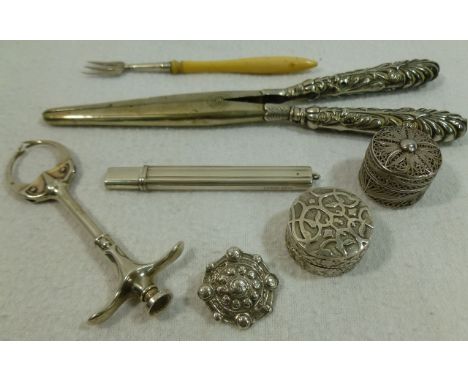 A collection of seven small silver items comprised of a pair of unusual spring action pickle tongs, Chester 1870, 9.6cm long,