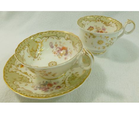 A Ridgway porcelain trio, pattern no. 2/6317, with light sage green ground and gilt borders and printed and painted floral sp