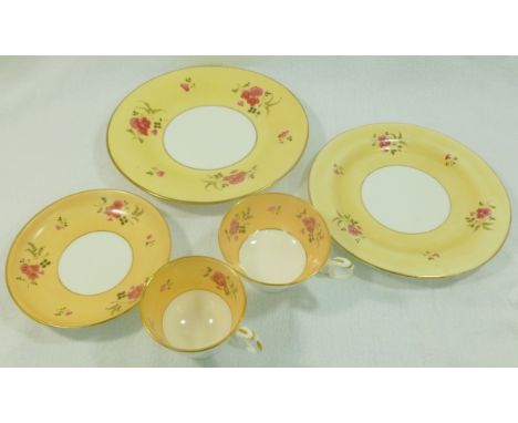 An H & R Daniel porcelain trio, plain edge shape, pattern number 4677, with peach ground decorated with hand painted pink flo