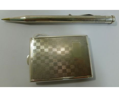 A George V silver matchbox holder with chequered engine turned decoration, Birmingham 1927, 6cm long, 1.15ozt, 35.8g, and an 