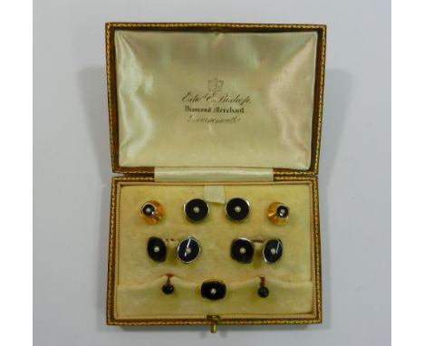 An early 20th century 18 carat white gold, 9 carat yellow gold, onyx  and seed pearl dress stud, button and cuff link set, ho