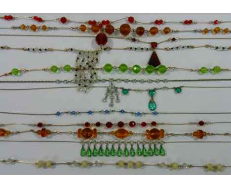 A collection of twelve Art Deco paste necklaces including rolled gold and silver examples. CONDITION REPORT: Some wear to the