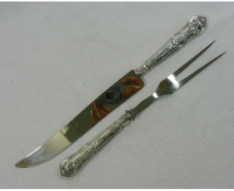 A pair of silver handled Kings pattern carving knife and fork, Sheffield 1957, knife 31cm long, matching lot 244 CONDITION RE