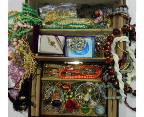 A quantity of assorted 20th century costume jewellery including a string of graduated coral beads, a silver and enamel bangle