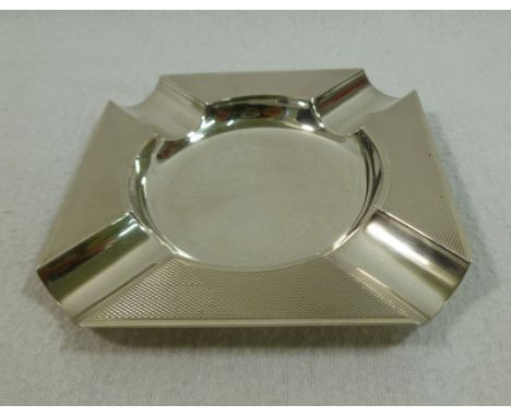 An Art Deco silver ashtray of square form with engine turned decoration, London 1944, by Mappin and Webb, 10.1cm wide, 2.21oz