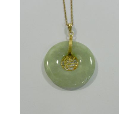 A Chinese gold mounted jadeite pendant, and chain, the circular pendant with pierced centre, 30mm diameter, the gold mount st