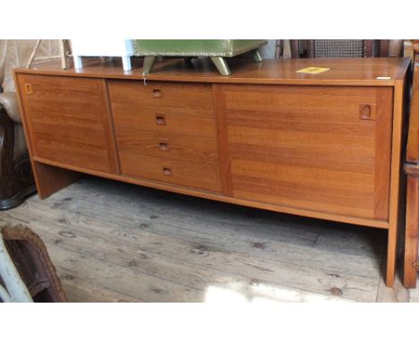 A Danish long sideboard with two sliding doors and central drawers